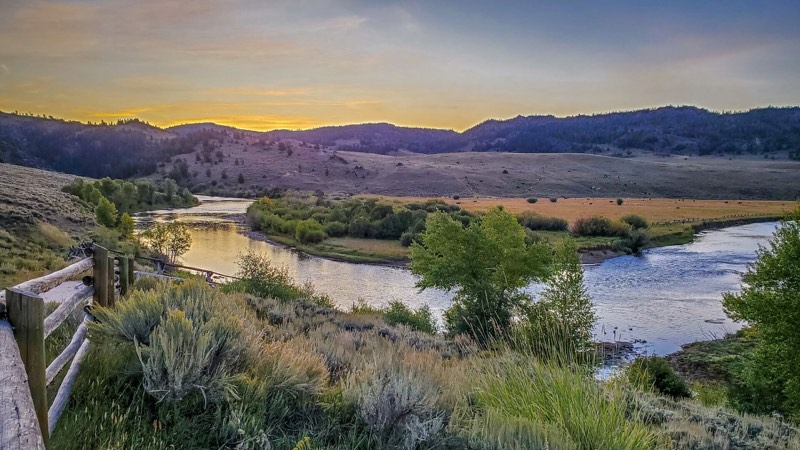 The North Platte River winding through grassland at sunset