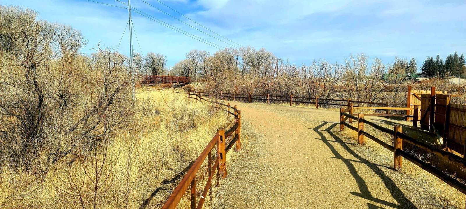A gravel walking path along the river edge in Saratoga